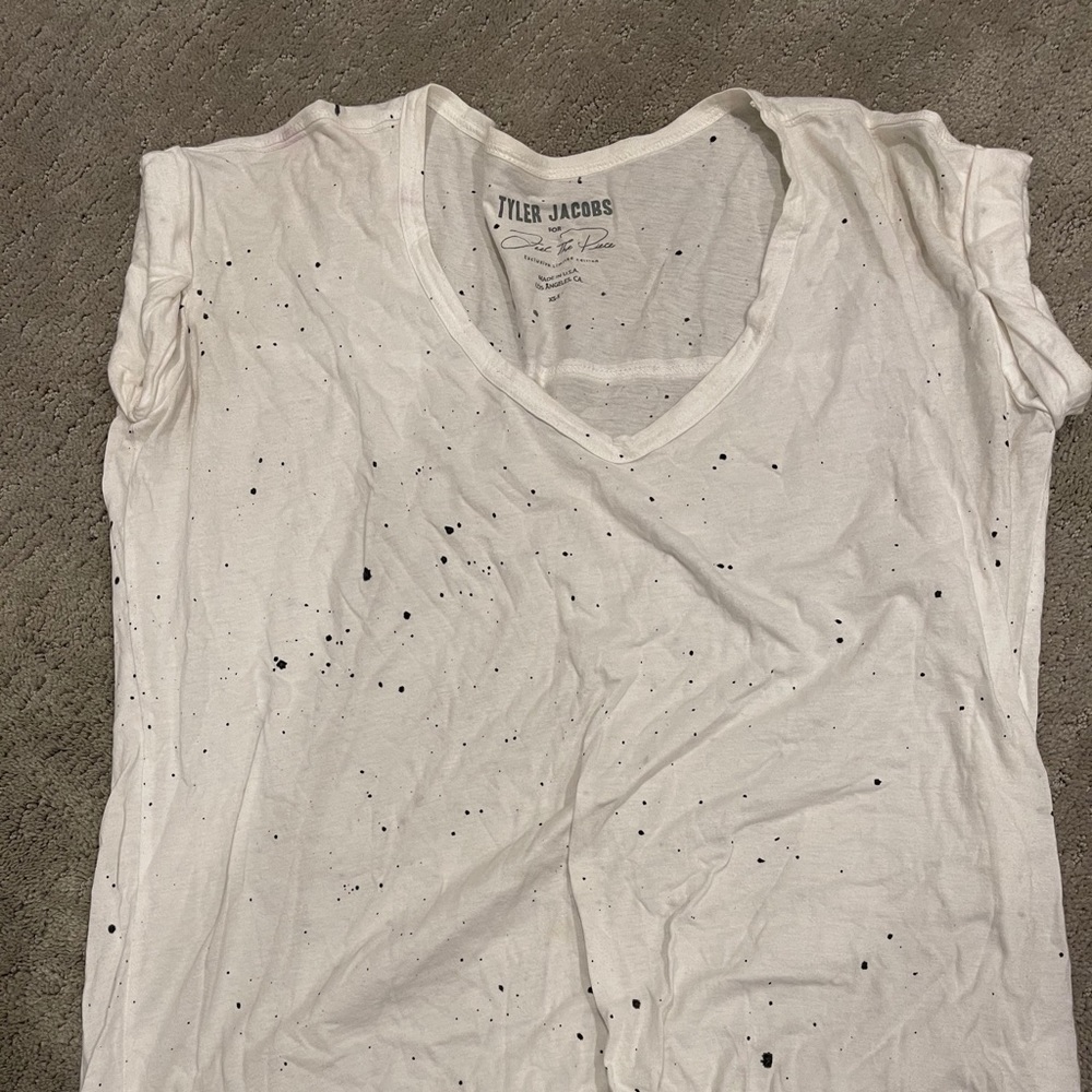 White t-shirt with black speckles